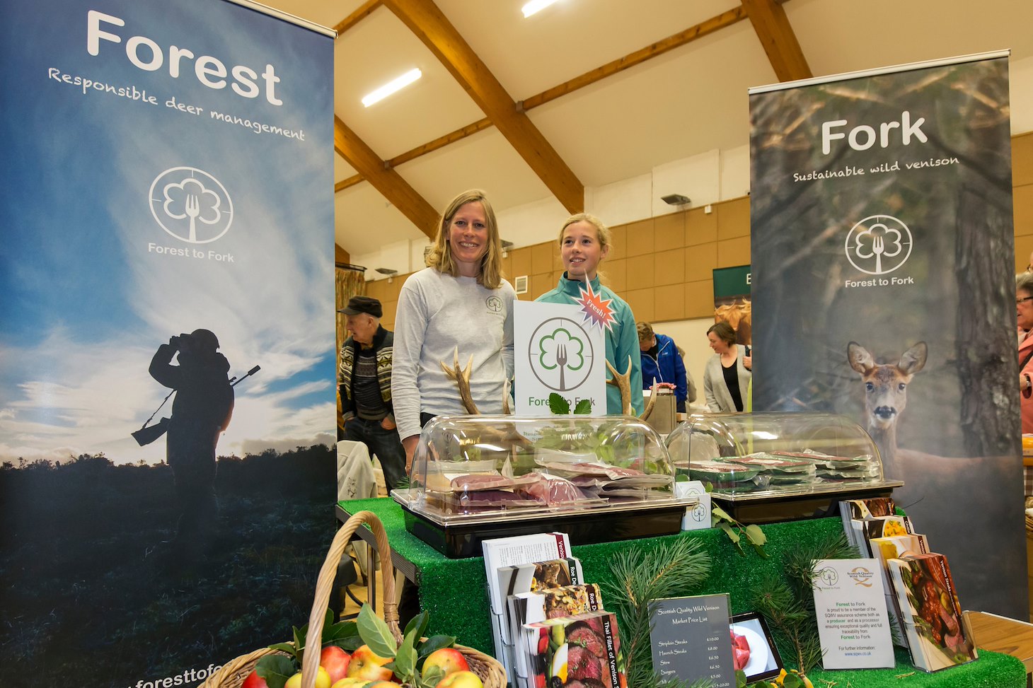 Nick Richards, owner of Forest to Fork, a supplier of wild venison in Scotland working with his family to sell wild venison at a Farmers Market in Culbokie.